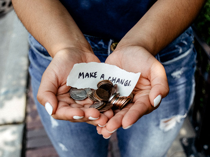 Hands with note and change