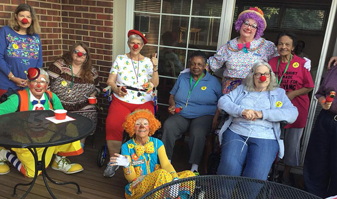 Happy people in clown noses